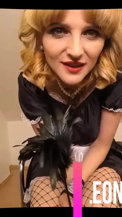 Solo mature maid pleasing her hairy cunt in her maid outfit and black fishnets