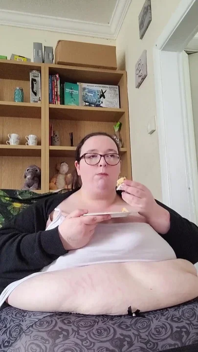 Eating cake and jiggling this massive belly
