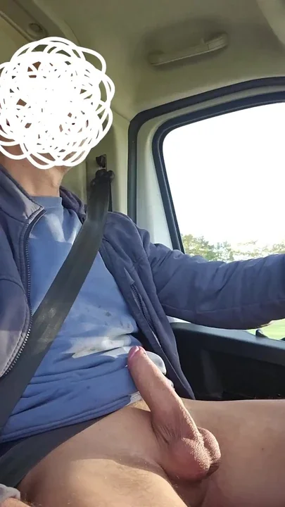 The handyman jerks off his big cock in the car while he is on his way to the