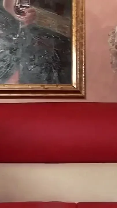 A Girl Dressed as Santa Claus Empties Balls
