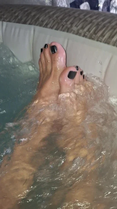 Showing my painted toes in the hot tub