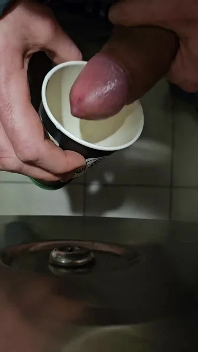 public Coffee cup refill with cum and piss at public toilette Clip 1