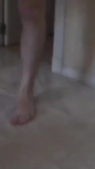 John is peeing on a towel on the floor