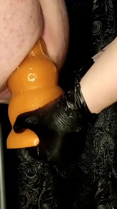 Mistress trains a slave's ass with huge dildos and feet