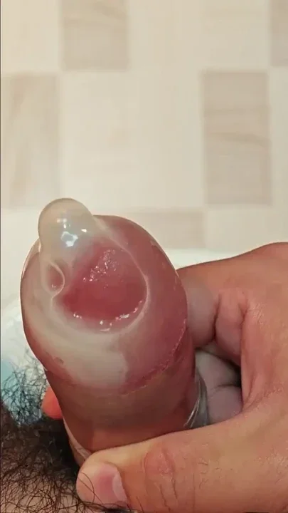 Cum again inside condom filled with semen Clip 1
