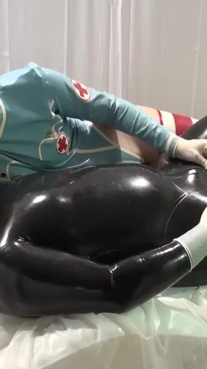 Latex Danielle - the doctor is playing with the patient's penis 2angle
