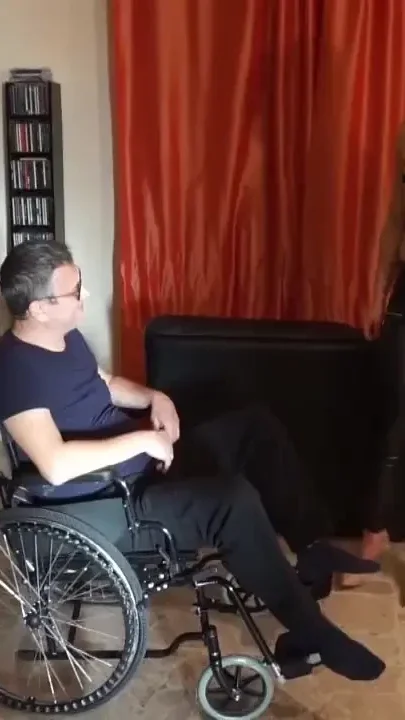 Slave in a wheelchair gets his ballbusting punishment