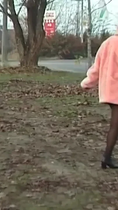 Redhead wife pissing in outdoor