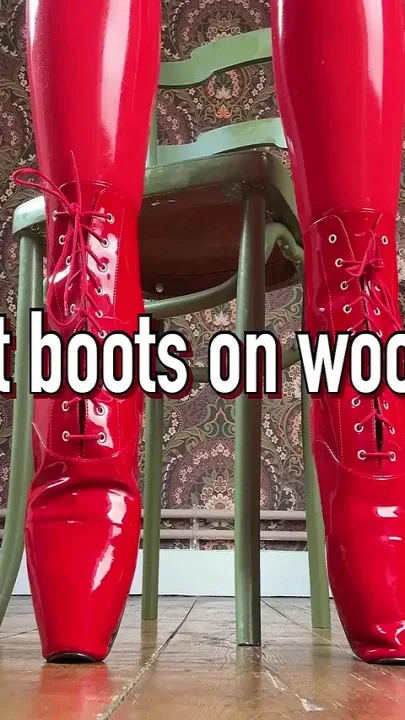 Red Ballet Boots on Wooden Floor