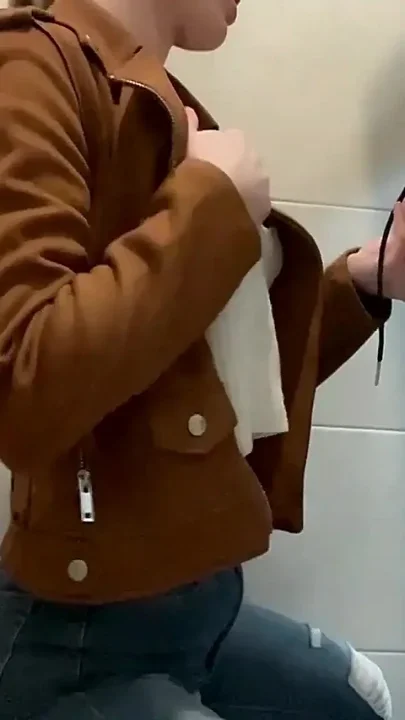 Busty Blonde Sucks Cock in the School Bathroom