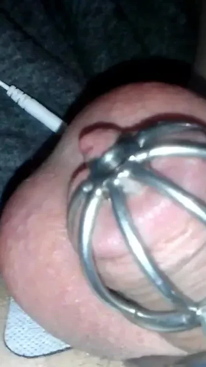 Pretty sissy Sadie caged e-stim orgasm