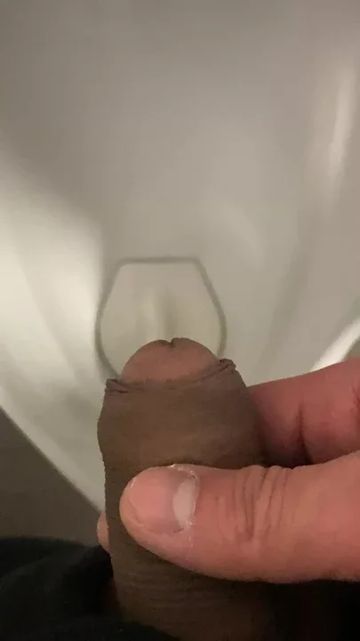 guy pissing in urinal