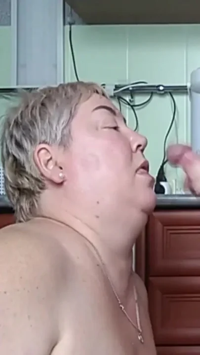 jerking off a dick and cumming on her face