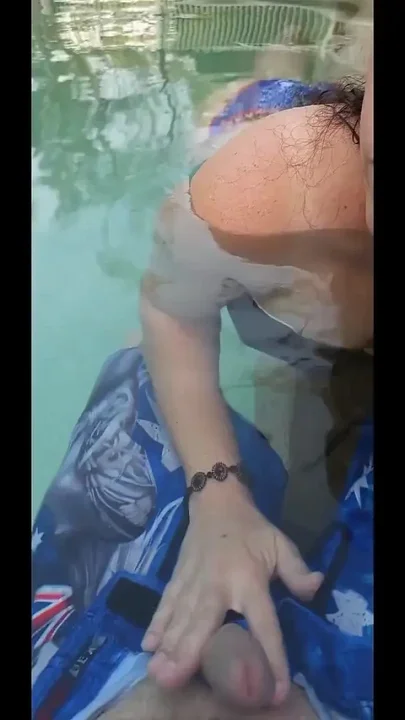 Horny Wife Giving Handie in Outdoor Pool