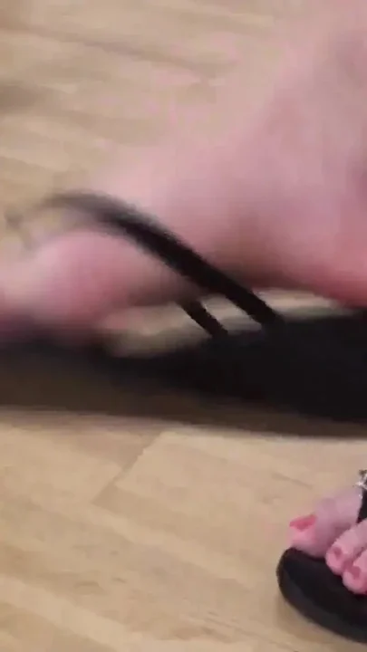 Jessica dangling feet under the table
