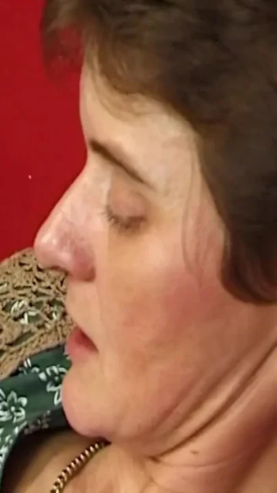 Horny granny gags on a long cock giving blowjob