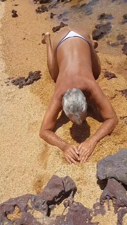 Ladysilva on all fours on the beach wanting cock in the ass