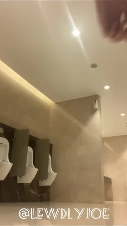 Jerking off wearing black socks in the mall toilet