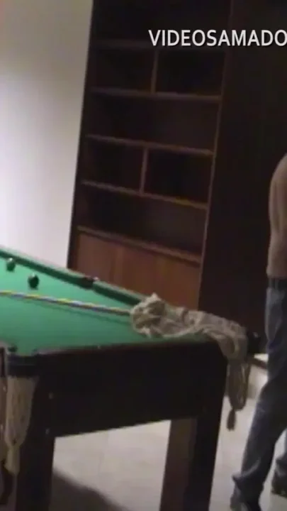 Couple having sex in the hotel game room in Brazil