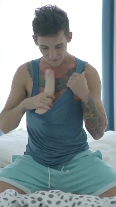 Hung inked boy Noah rides a huge dildo and barebacks himself