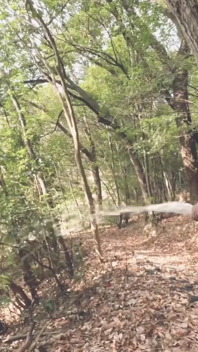 A boy with a small foreskin pees a huge stream outdoors Clip 1