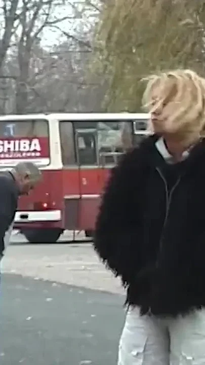 Young girl pissing on street