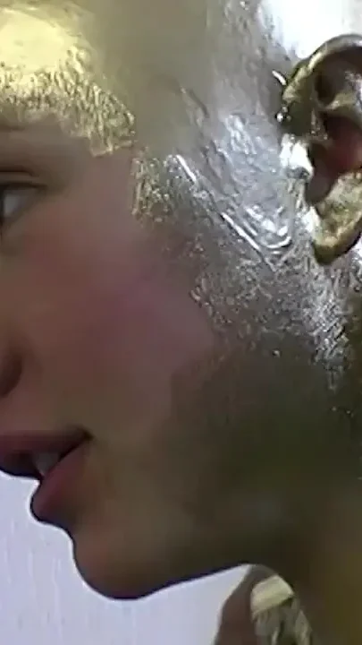 Real flexible contortionist gets golden painted