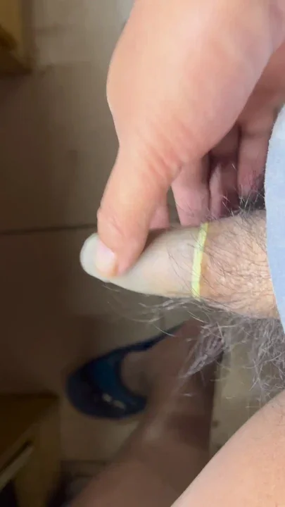 Cock wears a long green transparent balloon