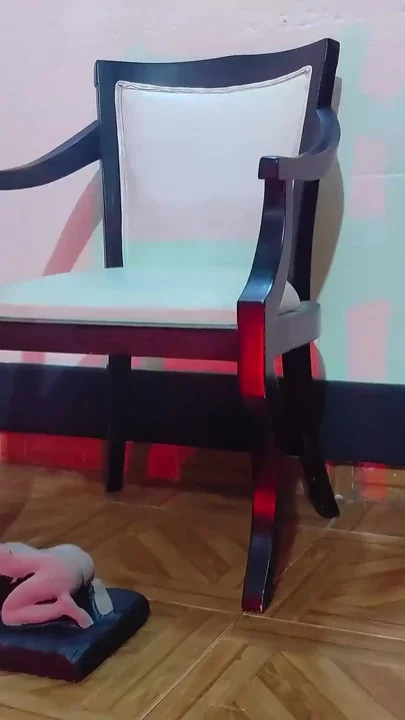 Giant Woman Keeps Her Lover Under Her Feet While She Sits Cross-legged