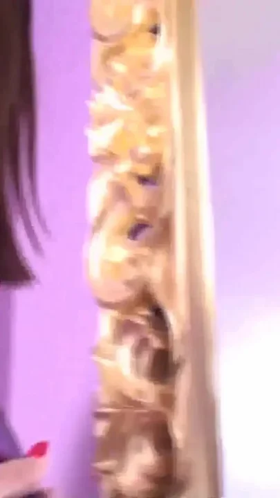 Admiring herself in the mirror and kicking her slave