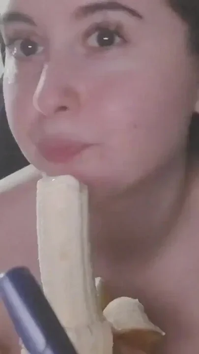 Supping and eating a delicious banana Clip 1