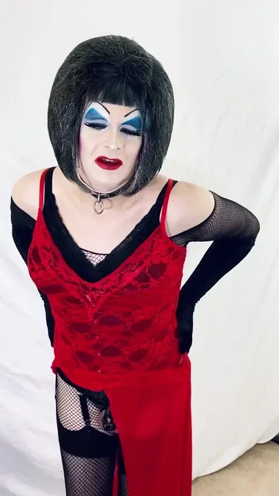 Heavy makeup drag slut strips to lingerie Clip 1