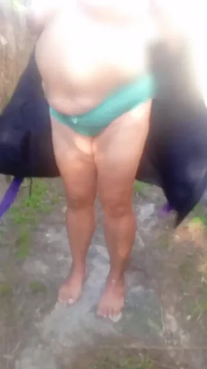 Mature grandmother walking naked outdoors Clip 1