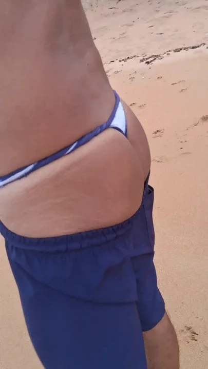 Ladysilva walking on the beach in thong