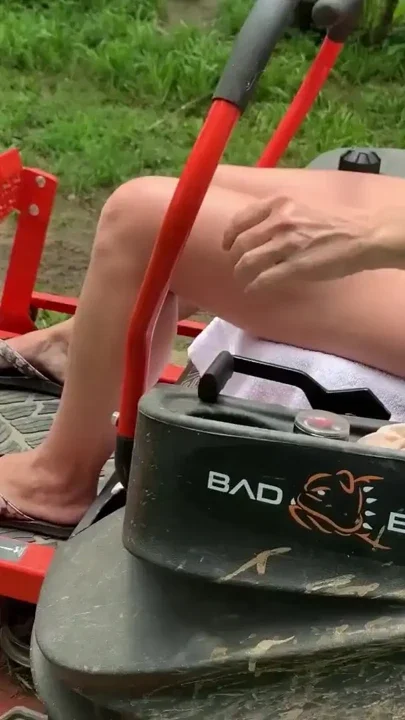 Titties out Riding lawnmower outdoors Clip 2