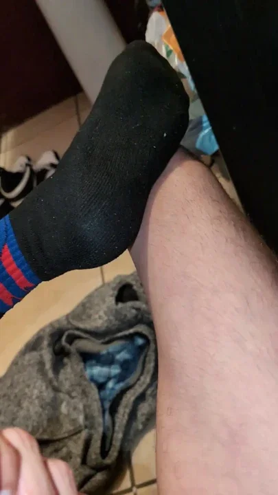Jacking off naked in my black and red socks