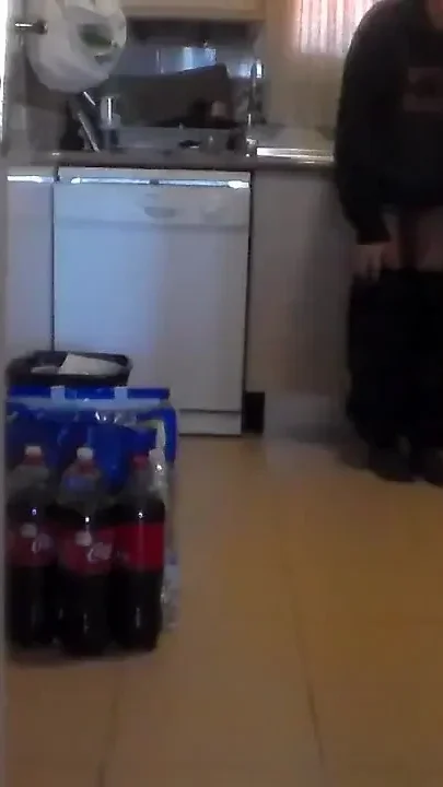 John is pissing all over the kitchen floor