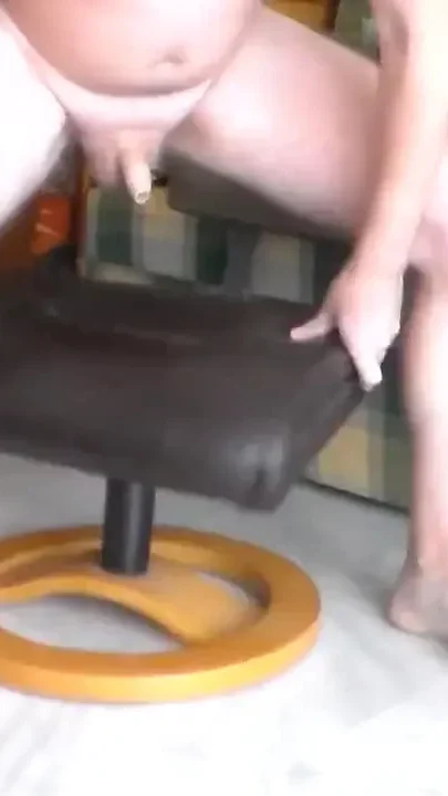 John is pissing all over the leather stool