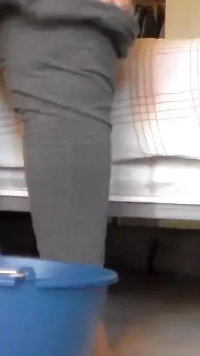 Jen is peeing into a blue bucket