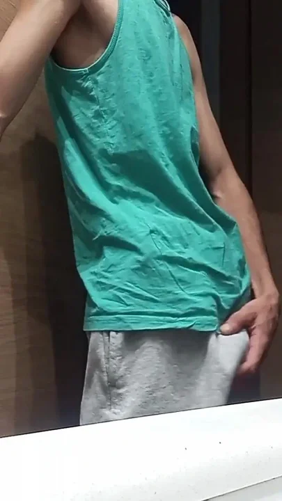 Slim Guy in a Tank Top Shows How He Cums with His Huge Shaved Cock