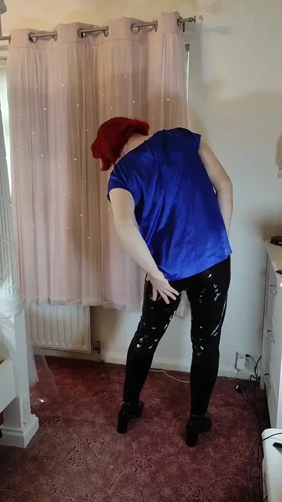 Hot crossdresser in satin blouse and pvc leggings