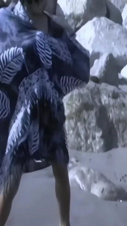 Lovely Little Oriental Betty Removing Clothes on the Beach