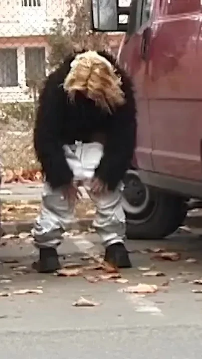 Girl peeing between the cars