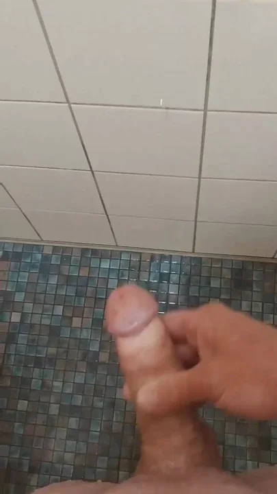 Wanked in the swimming pool under the shower Clip 1