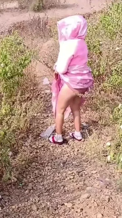 Sister-in-law is walking on the bridge by the roadside getting down on the shore