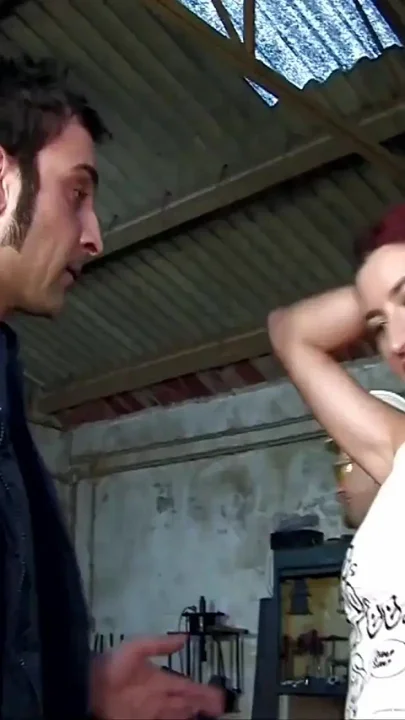 Two young sluts get fucked by workers in a garage