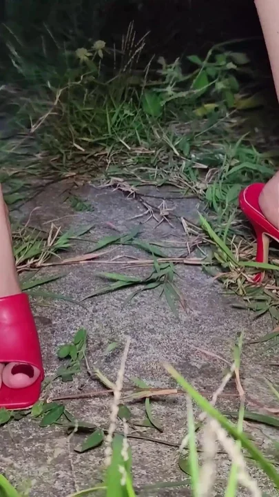 Woman in Heels Scratches Her Feet with Her Fingernails
