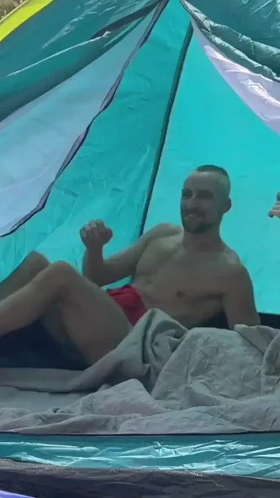 A couple of hot guys have wild sex on a beach causing vacationers to react to them Clip 1