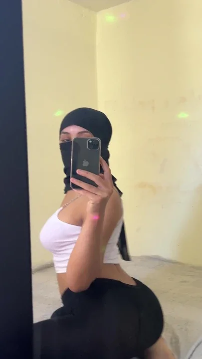 Arab Hijab Goddess Sits On Bed Teasing Fans While Arching Her Back And Showing