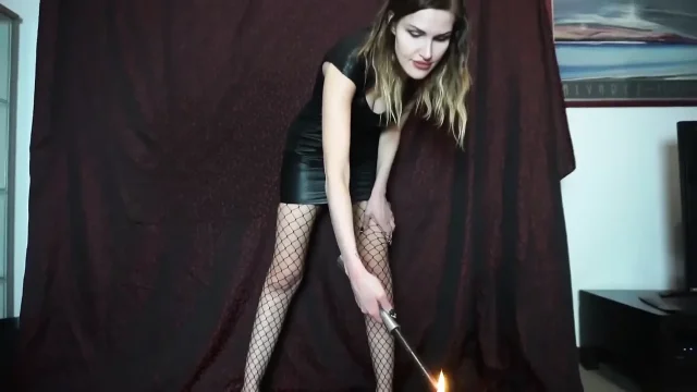 Mistress punishing his cock and body witn a wax